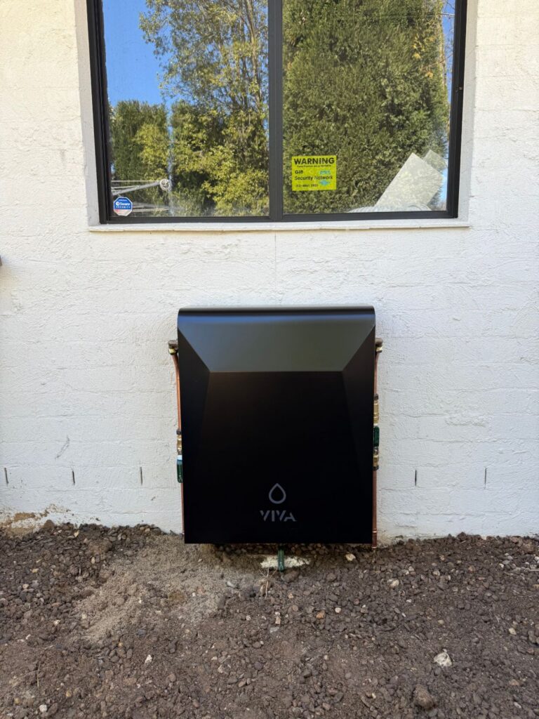 Completed Viva whole house water filtration system with protective cover installed by JRA Plumbing Services